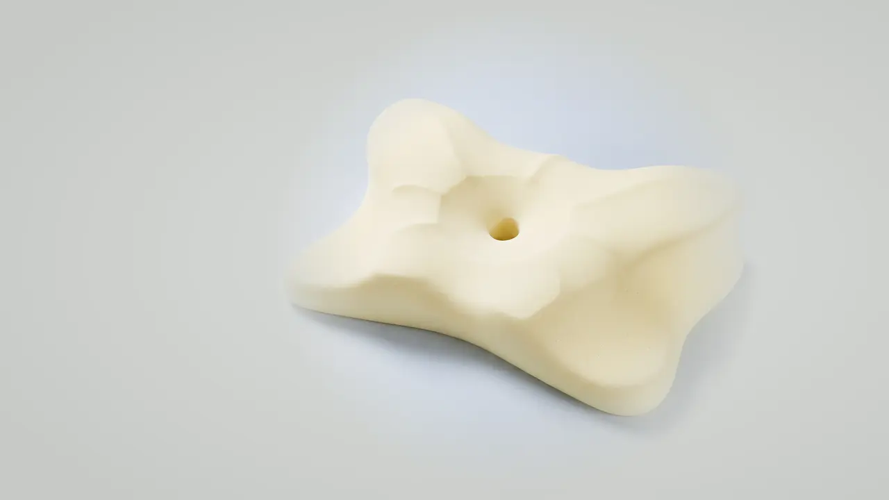 The memory foam core of the pillow with the cover removed